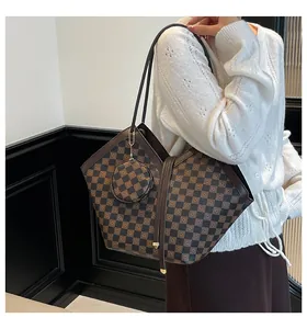 Detail of checkered tote bag with matching round coin purse and double shoulder straps