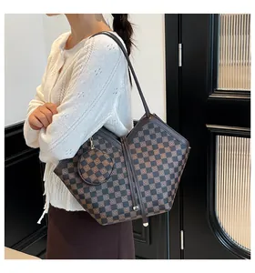 Detail view of checkered tote bag with a small round pouch shown on a fashion model