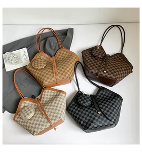 Detail view of plaid tote bags in various colors with matching round coin purses