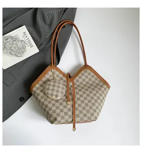 Flat lay of retro plaid bucket bag set with small round coin purse and brown leather strap