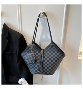 Macro shot of checkered bucket tote bag with matching round pouch detail on light background
