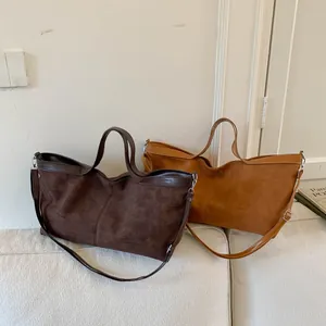 Retro tote bags in dark brown and khaki suede with smooth leather straps and silver hardware