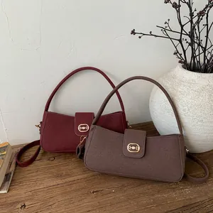 Detailed view of retro wool-like texture handbags in deep burgundy and dark coffee colors