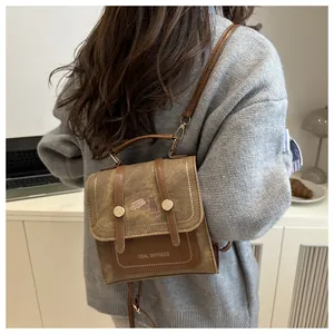 Retro canvas backpack featuring cat illustration and brown PU leather trim details