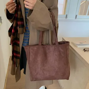 Brown suede tote bag with large capacity shown in a minimalist Korean fashion style