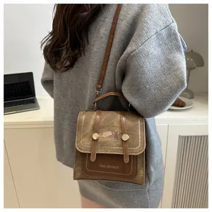 Retro canvas crossbody bag with cat illustration and leather details in a lifestyle setting