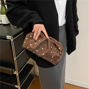 Deep brown leopard print cloud clutch bag with gold rivets and pleated texture