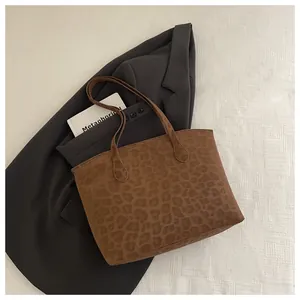 Close-up of leopard print tote bag with soft suede texture and large capacity design