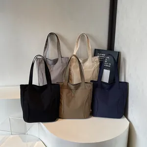 Japanese style minimalist nylon tote bags in five colors with large pockets and long handles
