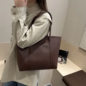 Minimalist large capacity dark brown leather tote bag for stylish urban commuting style