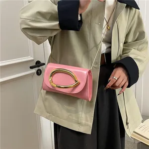 Pink patent leather crossbody bag with golden chain and metallic buckle for women