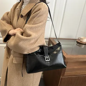 Retro black leather rectangle shoulder bag with silver buckle and sleek minimalist design
