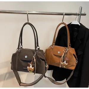 Retro suede Boston bags with geometric woven straps and cute bear charms