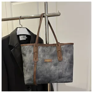 Macro detail of retro canvas tote bag showing leather logo and reinforced stitching