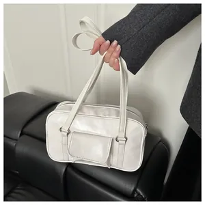 Detail of white rectangle handbag with double straps and front flap pocket detail