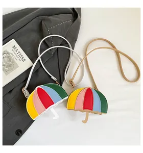 Detail of colorful umbrella-shaped crossbody bag featuring multi-color patchwork PU leather