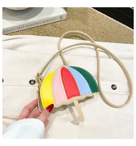 Detail of creative rainbow umbrella shaped crossbody bag with colorful PU leather stitching