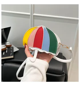 Close-up of a mini umbrella-shaped crossbody bag with vibrant rainbow leather panels