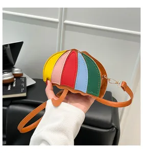 Detailed view of creative umbrella shaped crossbody bag with vibrant multicolor patchwork