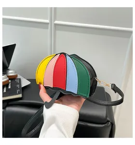 Detail of a mini umbrella-shaped crossbody bag with vibrant colorful patchwork panels