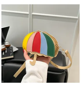 Detail of creative umbrella-shaped crossbody bag with colorful leather patchwork