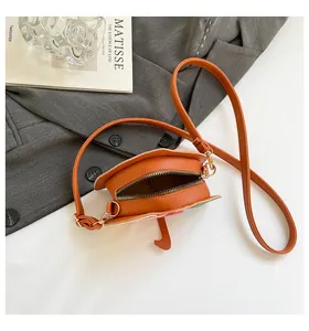 Detailed macro view of the interior space of the orange mushroom-shaped shoulder bag