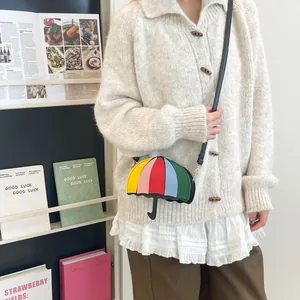 Unique rainbow umbrella shaped crossbody bag in colorful leather patchwork design