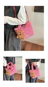 Detail of pink faux fur bucket bag with cute bear charm and adjustable shoulder strap