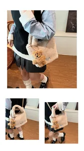Detailed view of beige faux fur bucket bag with a cute brown bear charm on model