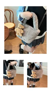 Detail showing the plush faux lamb wool texture and cute bear pendant on the bucket bag