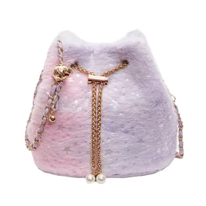 Cute pink purple gradient plush bucket bag with star sequins and cat ears on white backdrop
