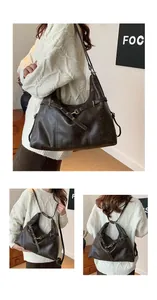 Detail of vintage brown leather backpack and tote bag with adjustable shoulder straps