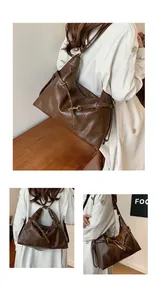 Detail of dark brown multifunctional bag showing adjustable straps and various carrying styles