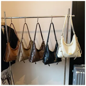 Detail view of large capacity Hobo bags in five colors with metal logo and adjustable straps