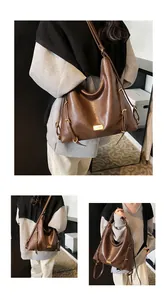Macro detail of dark brown PU leather texture and adjustable metal buckle on hobo bag
