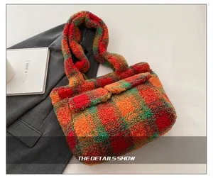 Detail showing the wide plush shoulder strap of this colorful plaid tote bag for women
