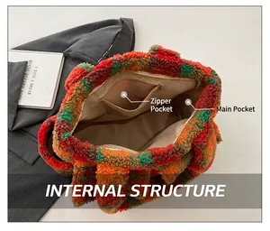 Detail view of the plush checkered tote bag interior showing the main bag and zipper pocket