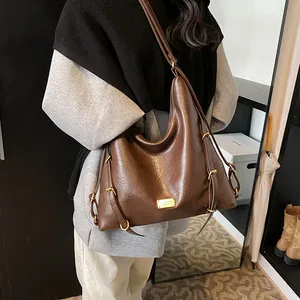 Large dark brown faux leather tote bag with lychee texture and gold metal logo plaque