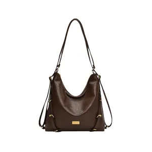 Dark brown large capacity leather tote bag with gold hardware and multi-wear straps
