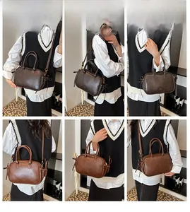 Detailed views of vintage faux leather crossbody bag with dual handles and tassel accents
