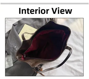 Vista interna della grande borsa tote in ecopelle marrone con fodera bordeaux e cerniera