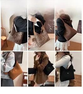 Detail view of stylish leopard print and matte leather shoulder bags for women