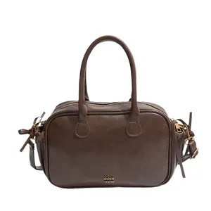 Vintage dark brown leather Boston bag with top handles and adjustable shoulder strap