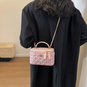 Pink tweed crossbody bag with camellia detail and gold chain strap for women