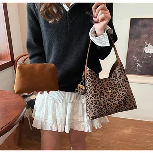Three-piece leopard print bag set including a large tote and a brown zipper pouch