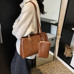 Brown vintage faux leather tote bag with small pouch and shoulder strap for women