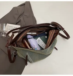 Interior view of spacious canvas tote bag with leather trim and daily essentials