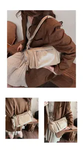 Détail du sac vintage en cuir souple beige avec fermetures éclair et bandoulière réglable