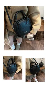 Detailansicht der schwarzen Kunstledertasche mit Patchwork und Marken-Schriftzug