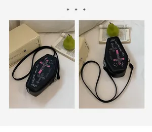 Gothic coffin-shaped shoulder bag featuring silver cross embroidery and pink inverted cross